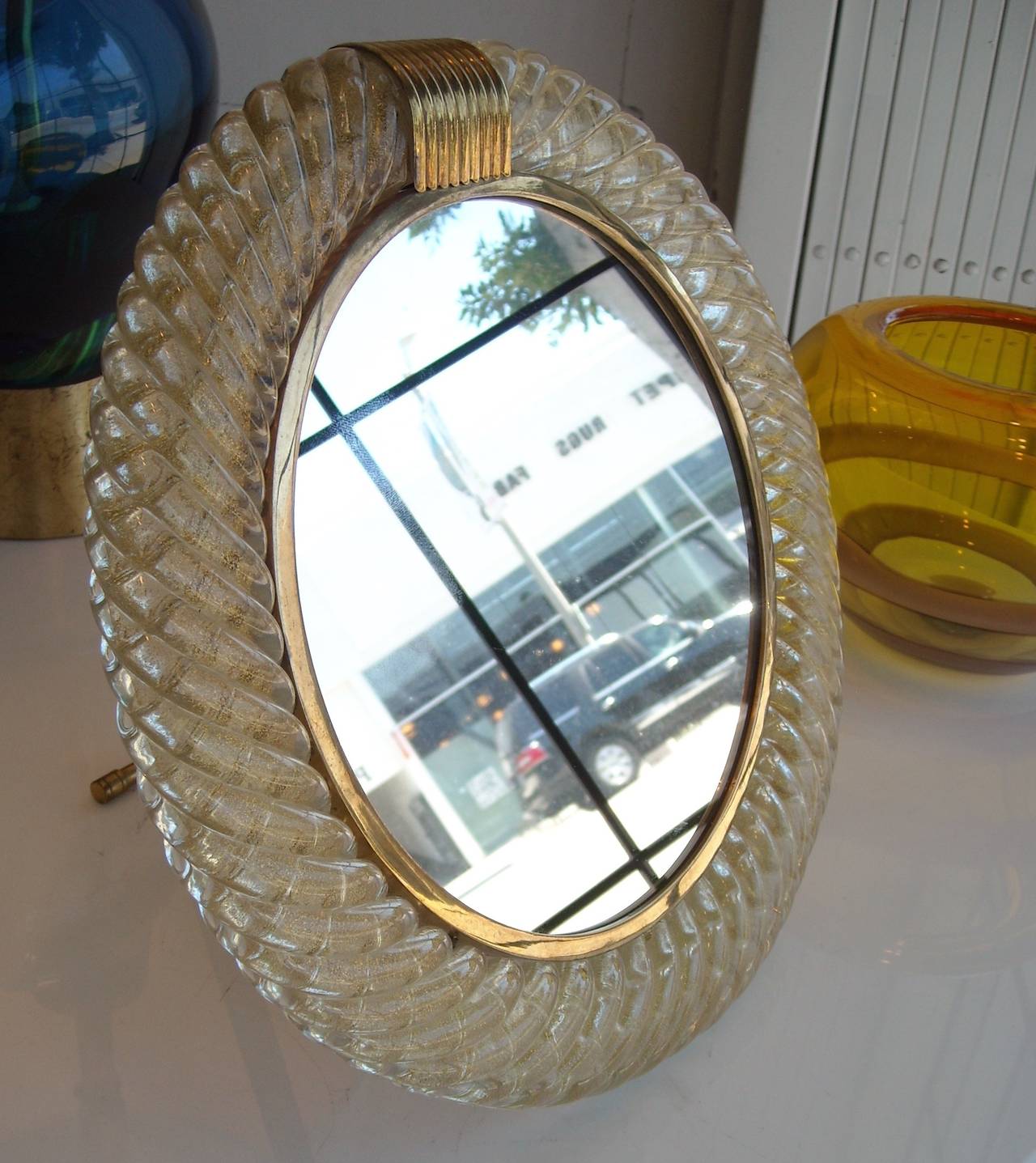 Great vanity gold glass and brass mirror, partial early red label in back as shown in picture.