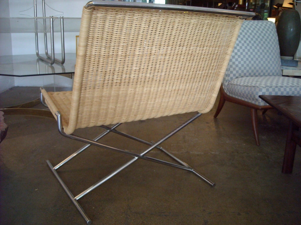 Mid-20th Century Ward Bennett sled chair in chrome and wicker.