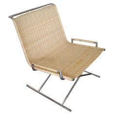 Ward Bennett sled chair in chrome and wicker.