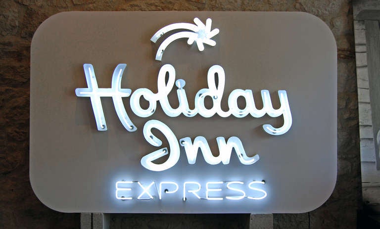 old logo, new face. stripped, repaired and tweeked holiday inn express sign. with new logo going up around the country, the old signs are being recycled in a fun way. 