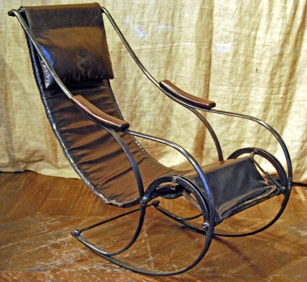 1850s upholstered chair, similar rocking-chair was shown by R.W. Winfield at the great exhibition in 1851. After which iron rocking-chairs became popular throughout Europe during the second half of the 19th century. Though called a rocking-chair, it