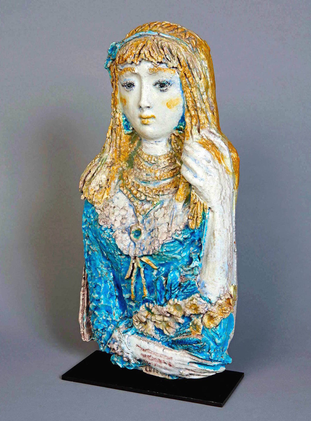 The best piece by this very idiosyncratic artist that I have seen in many years. Ugo Lucerni (Italian, 1900-1989) was something of a 20th century Andrea della Robbia. This girl, with her enigmatic expression, has a wonderful presence in any room. A