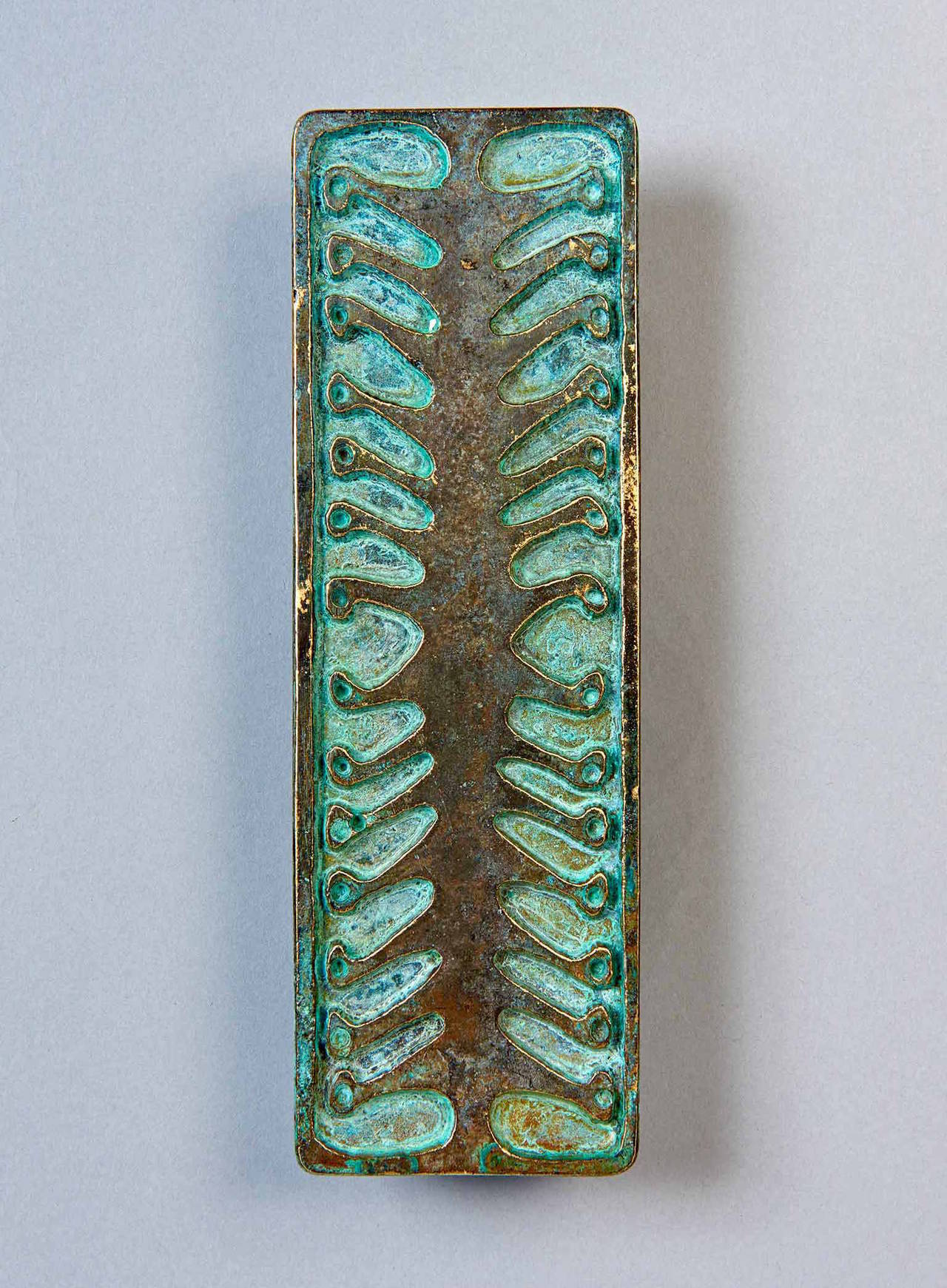 These gorgeous bronze door pulls were designed by ceramist Jerry Ackerman, and cast in Italy in 1967. Jerry and Evelyn Ackerman, about whom an excellent book has recently been published, are after Charles and Ray Eames, the most era-defining married