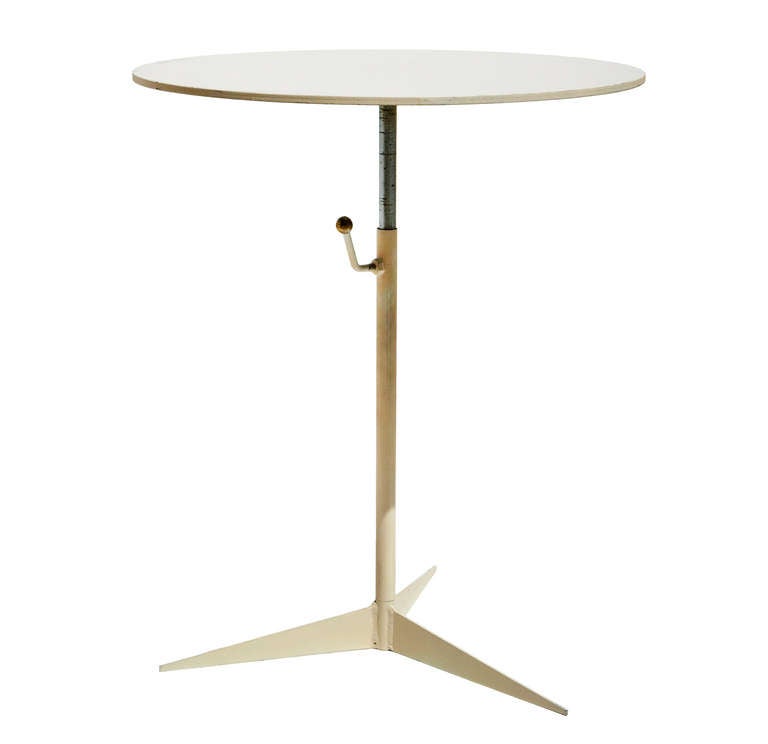 Made in the beautiful Palos Verdes section of Los Angeles during Southern California's Golden Era of design, this delicate all-white table is usefully adjustable for height.