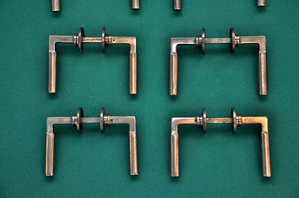 The famous door-handle designed in 1923 by Bauhaus master Walter Gropius is one of the great icons of modernism. <br />
<br />
Six pairs are available (though eight sets are shown, two have been sold already). Each pair, with all associated