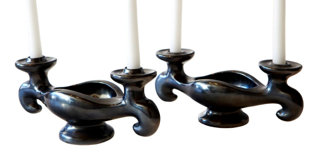 We found these unsigned ceramic candlesticks in Normandy. The sublime gunmetal black matte glaze and fantastic stylized 