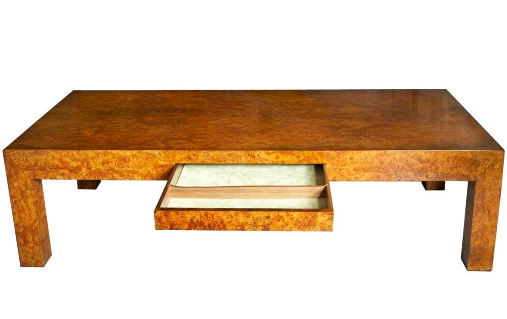 The diagonally book-matched Carpathian elm burl veneers on this superb Stewart MacDougall coffee table are golden and glowing; the table's self-confident presence makes any room it sits in a 1963 Jaguar Mk. 10 writ large. Whether the velvet-lined