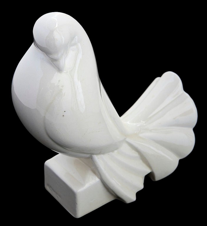 A superb Art Deco turtledove by Jacques Adnet in ivory-colored céramique craquelée, originally presented at the landmark Paris show which gave Art Deco its name, the 1925 Exposition des Arts Décoratifs et Industriels Modernes. Three years later,