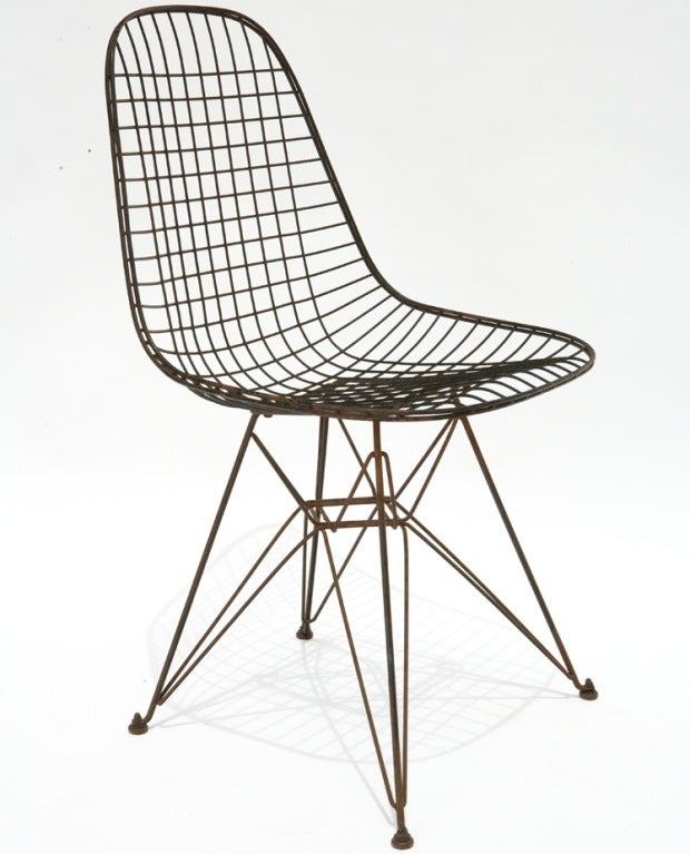 The screw-on glides (image 7) and square seat base (image 5) mark this chair as an early production example of the Eames 