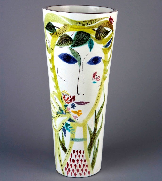 Stig Lindberg established his reputation in the 1940s with an exuberant collection of faïence pieces he designed for series production.  The international popularity and artistic influence of these vases, bowls, trays, candleabra, cups, and mirror