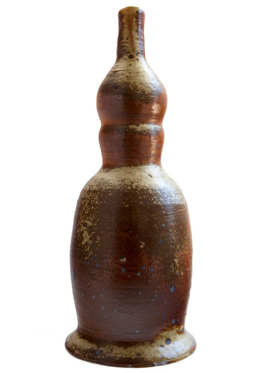 A rare piece by La Borne ceramists Jean and Jacqueline Lerat: vigorously potted, partially glazed, and finished in a wood-fired kiln at their atelier in Bourges, France. This rather tall piece was originally a lamp base, but is a beautiful vase as