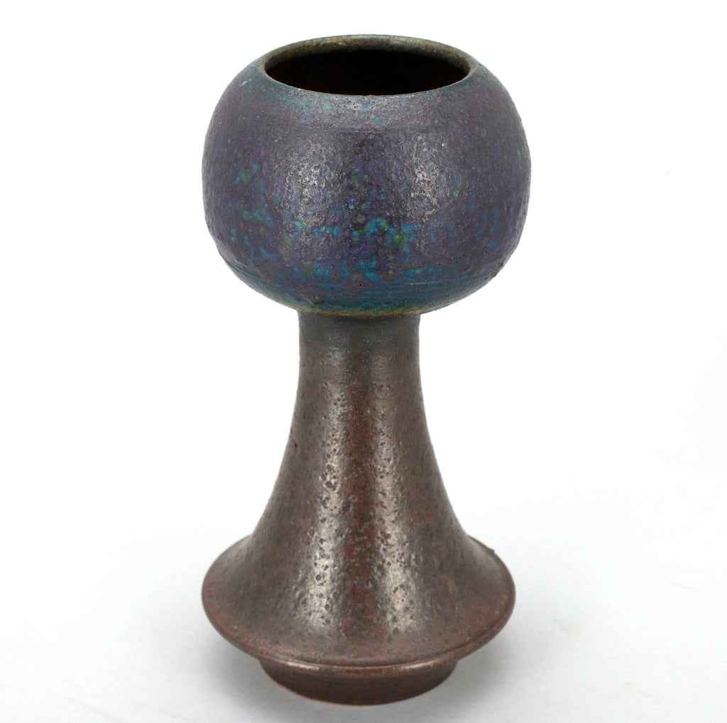 Gorgeous form (very 1960s Finnish), gorgeous texture (chamotte, also very Finnish), gorgeous color (variegated blues and browns). From the period when people believed that the right sort of domestic objects could help, in some very small way, point