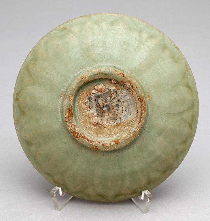 A lovely celadon bowl, an excellent example of the sort of porcelain regularly used by well-to-do Chinese 600 years ago. Exterior decorated with carved, overlapping lotus petals.