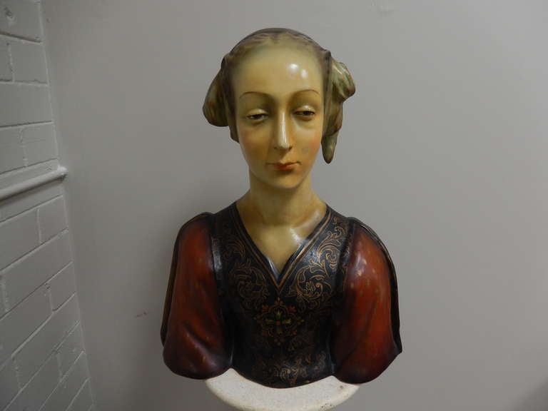 Large Antonio Pallaiolo bisque bust of a Renaissance period woman, dating to the 1920's.  Polychrome decoration is original and in very good condition. Extremely detailed. Bust is signed, along with 