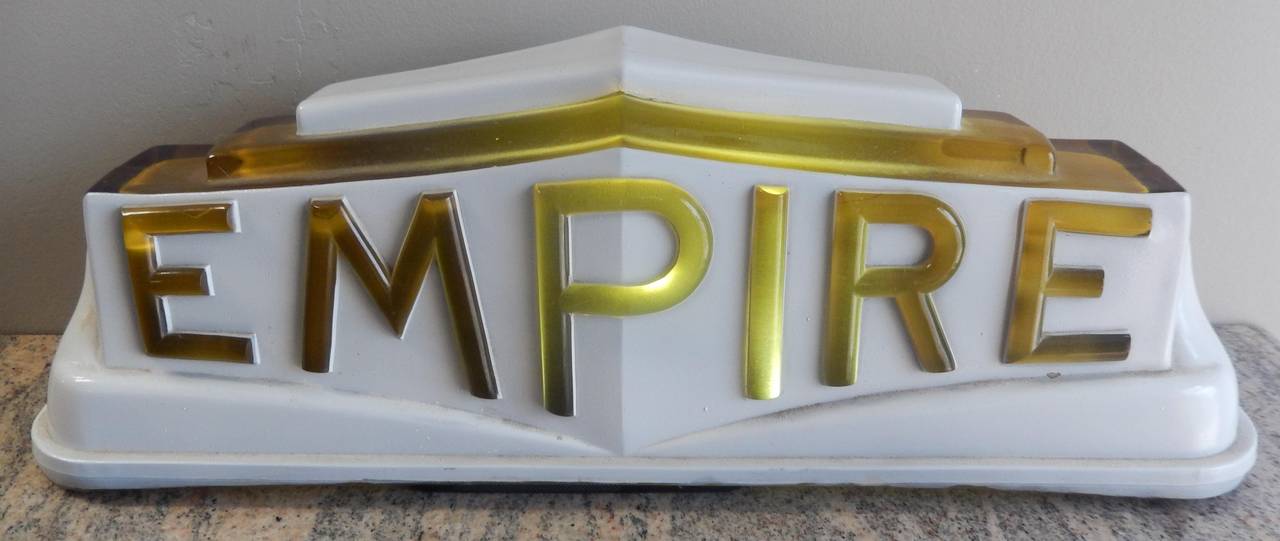Extremely rare Empire Cab Company (New York City) amber and white glass roof light, dating to the early 1930s.

These are so rare in fact; there are only a handful of this model in existence, and none we've found from 