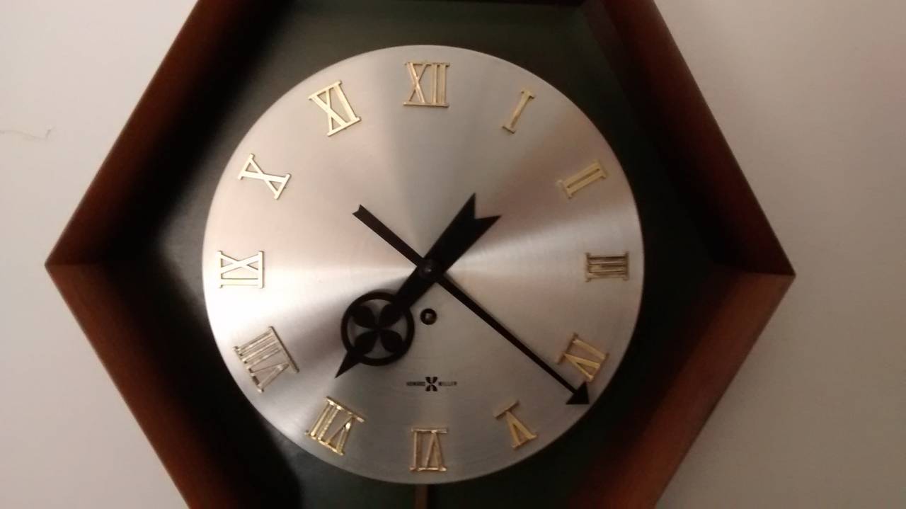 Mid-20th Century Wall Mounted Pendulum Clock by George Nelson for Howard Miller For Sale
