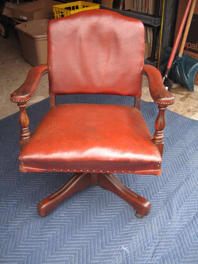 Awesome recent estate find is this completely original leather rotating and swiveling office chair, dating to the late 1920's.  

These are extremely rare to find in their original finish, leather covering, and nail head trim.

Archival cleaning