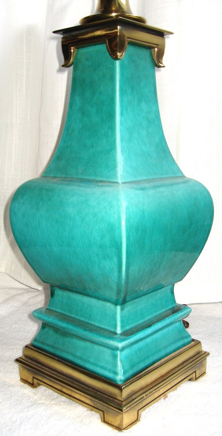 Magnificent recent estate find is this large Stiffel Lamp Company table lamp dating to 1960. 

Rendered in high turquoise glazed ceramic with brass plated steel mounts, this lamp retains it's original white glass reflector and wiring, in working