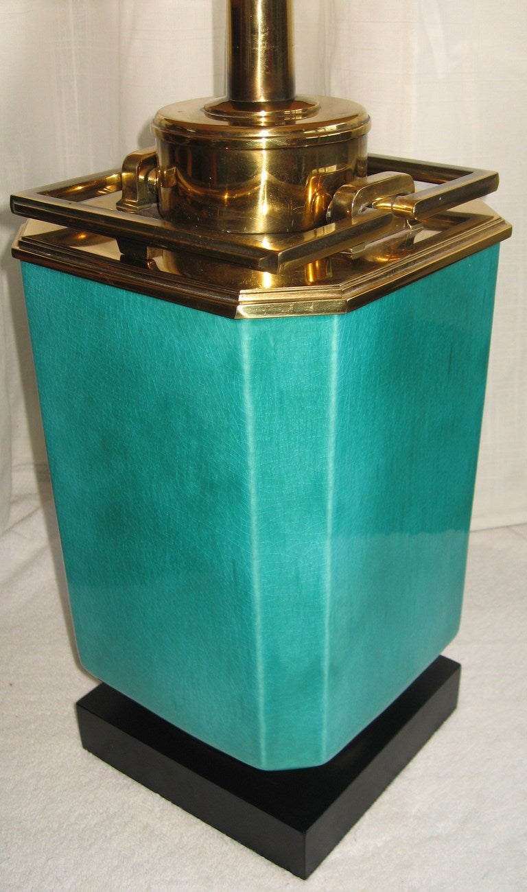 Recent estate find is this beautifully preserved Stiffel high turquoise glazed ceramic table lamp, dating to 1960.  

Brass plated steel mounts and a wood base support this bright peacock colored glazed ceramic body.  Wiring is original and in