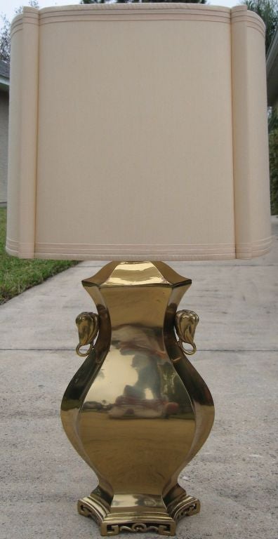 Superb early 60's Marbro table lamp rendered in solid brass with original hardsided shade in excellent original finish and condition. Beautifully deatiled and extremely heavy, this lamp is estate fresh and ready to use. Pullchain sockets are