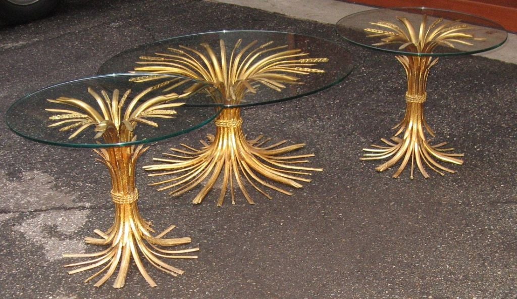 Estate fresh single gilded wheat sheaf coffee table, dating to the 1950's. This coffee table is rendered in gilded steel, made in Italy, and retains it's original glass top. Excellent original finish and condition. 

ONLY COFFEE TABLE AVAILABLE