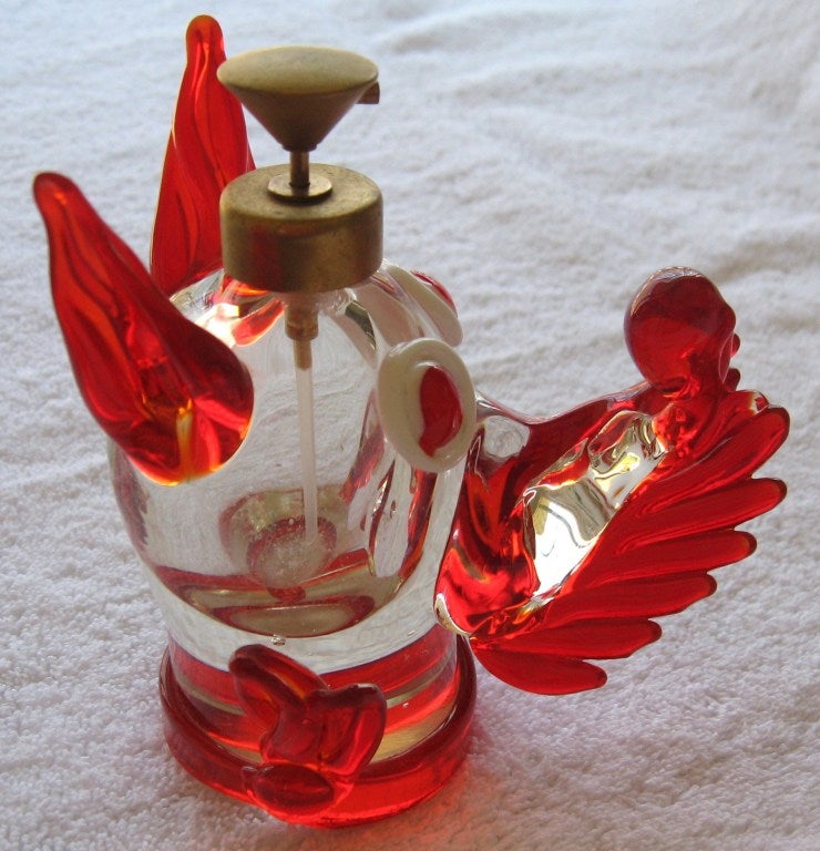 Great estate find this week, apparently unused circa 1950-1955 period murano glass perfume atomizer in the image of a Scottie dog. Rendered in vibrant reds and white over a clear body. Original gold plated atomizer still present and in working