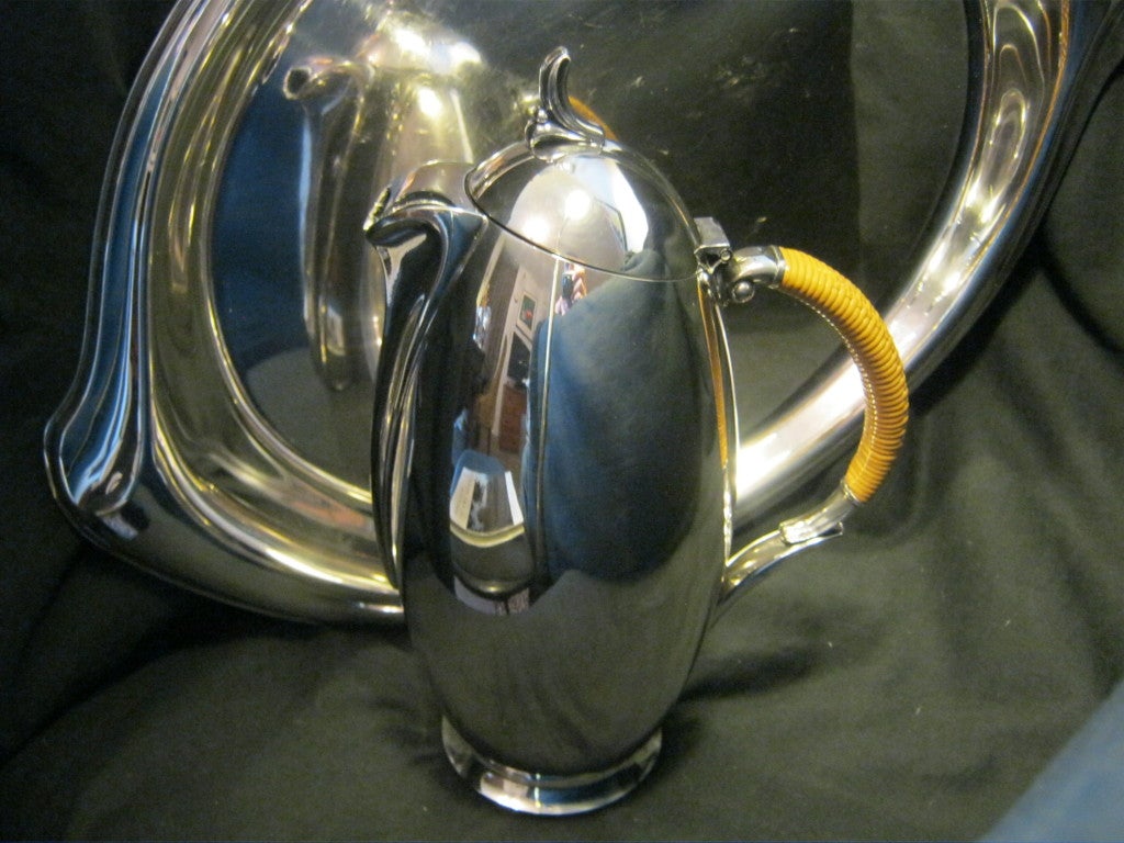 Immaculate 1956 silver plate coffee service consisting of a coffee pot, lidded sugar, creamer, and a waiter's tray.  

The 