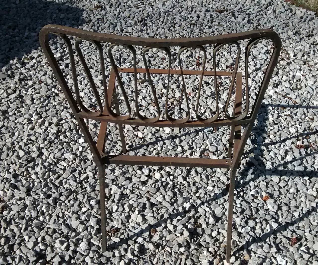 Elegant pair of ribbon form outdoor chairs by Salterini, dating to the late 1950s. 

Rendered in iron, this pair are very heavily made and were originally black and are sold in as found condition with light surface rust and without seats. 

An