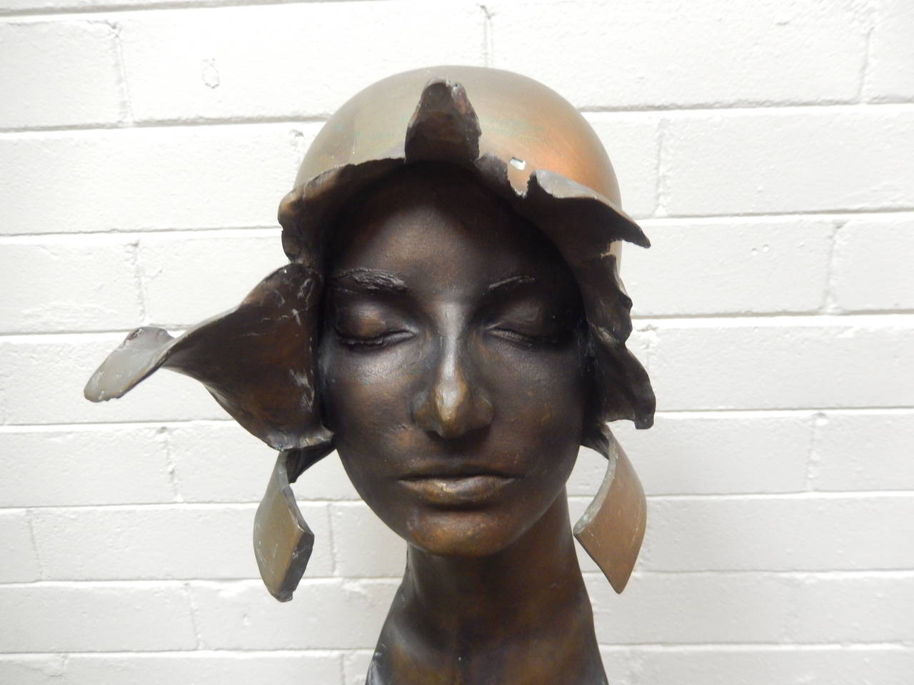 Cutaway model in bronze by William Ludwig, 1978. Depicting a female form nude with pearls and a bonnet. 

William Ludwig attended art school in the early 1960s when a formal, academic education was strongly emphasized. At the Hartford Art School,