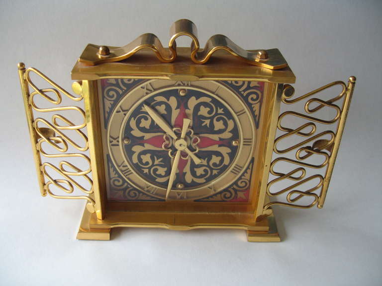 Recent estate find is this wonderful Gubelin signed petite size carriage clock, dating to the late 1940's.  Founded in 1854, Gubelin is a Swiss jewelry and watch maker, still family owned and operated to this day. 

Rendered in gold plated