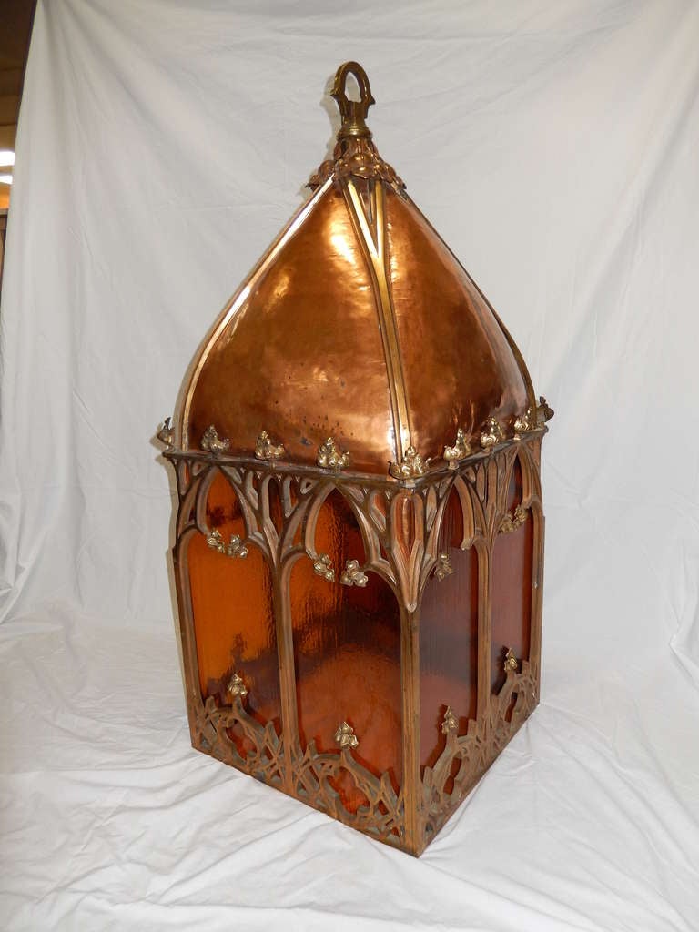 Superb, and gigantic American 19th century pendant chandelier from a Gothic revival church.

Rendered in copper and brass, this fixture is in excellent condition, with antique glass panels replacing the originals in a recent retrofitting. 