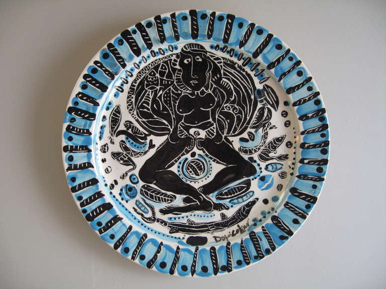 Large modernist form ceramic charger by Cuban artist Vicente Dopico Lener, Vibrant blue against black and white with a female form and attendant sea creatures. Large and impressive example of this artist's work.