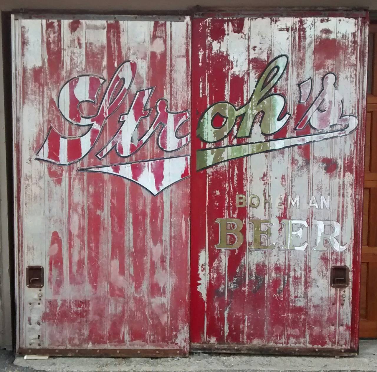 Thrilled to get this amazing pair of Stroh's Beer sliding truck doors, displaying fifty years worth of weather worn signage. 

Rendered in aluminum and steel framing, this pair measure an impressive 83