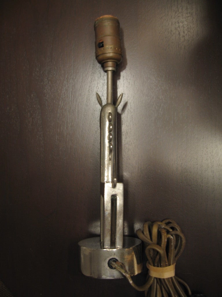 Recent estate find is this lovely and petite stylized giraffe form table lamp by Karl Hagenauer, dating to the 1930's. 

Rigid Art Deco form, this nickel over bronze child's size table lamp measures 12