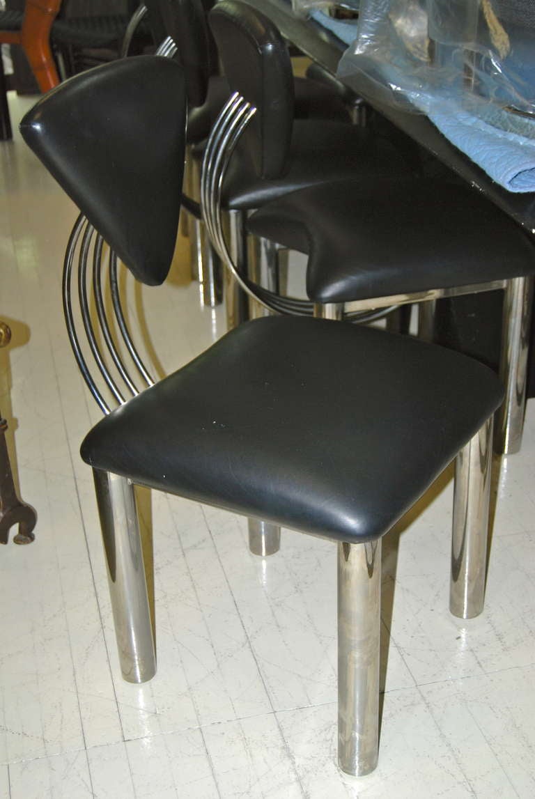 Great ! Set of 10 sculptural dining chairs executed in steel and black naugahyde fabric. Extremely comfortable. Great with modern,memphis or industrial decor. For additional questions regarding this item, please click the contact dealer button or