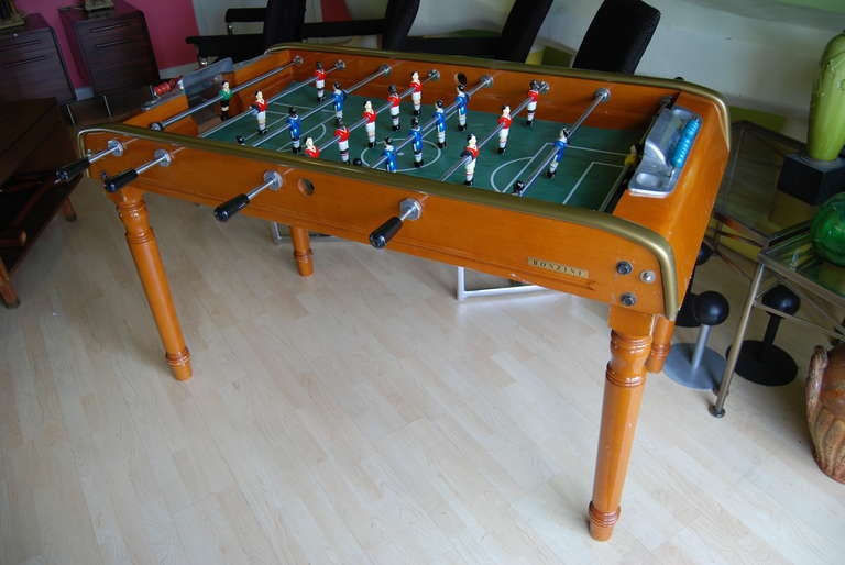 Fun for the entire family! French foosball table by Bonzini. Table consist of hand painted metal  figurines and lacquered beech wood case. Perfect for your game room. For additional questions regarding this item, please click the contact dealer