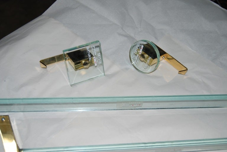 

Wonderful crystal and polished brass bathroom accessories by Fontana Arte ( Marked Fab- Made in Italy). Accessories are dead stock, and have never been utilized. The flat bar or curved towel bars range in size from 18