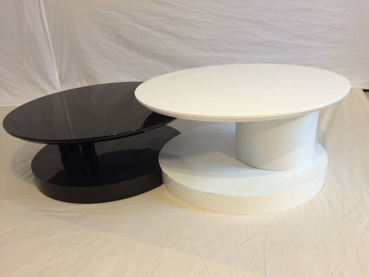 The table is in two parts. The white one is higher and swivels.
