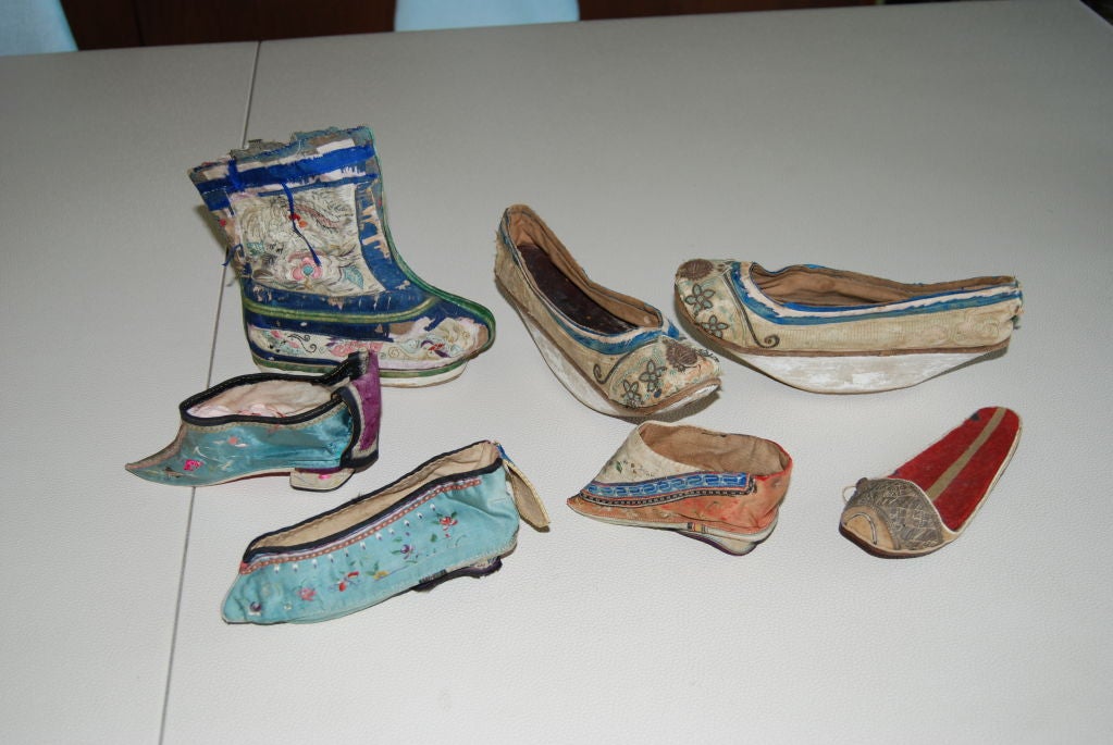 Wonderful collection of seven , 19th century - 1930's Chinese bound shoes.The pair is unusual with a wedge form heel.Beautiful silk embroidery.All shoes measure six to seven 5