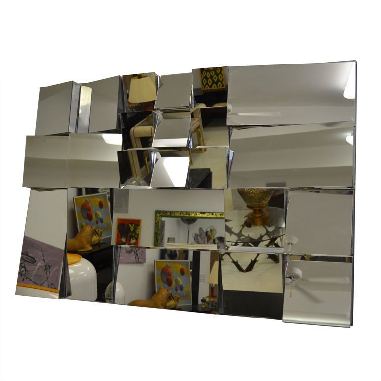 MESMERIZING SLOPE WALL MIRROR DATED 1972 at 1stDibs