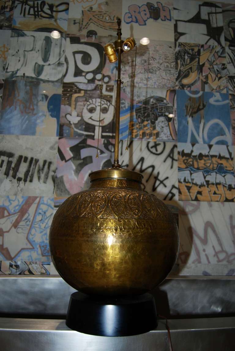 Pair of brass lamps, James Mont style. Lamps have a wonderful design to each as shown. Each lamp has two light sockets
