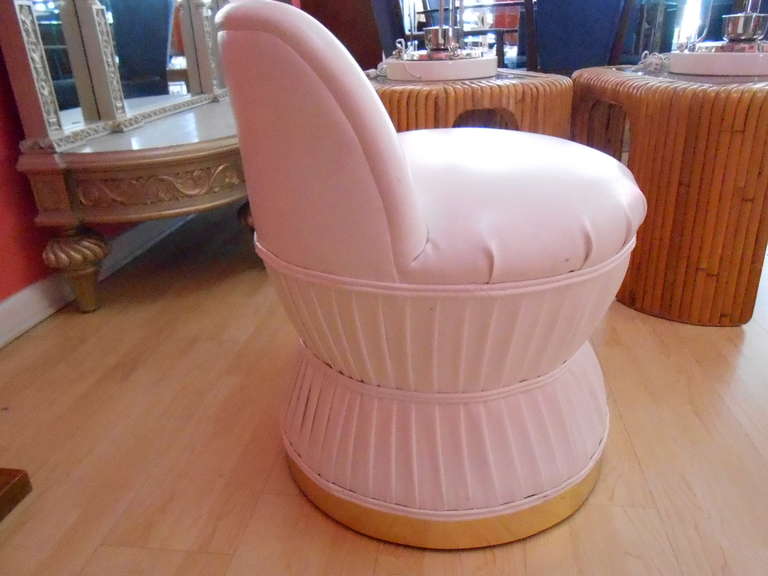Milo Baughman style tub vanity chair executed in a faux white leather with circular brass banding.