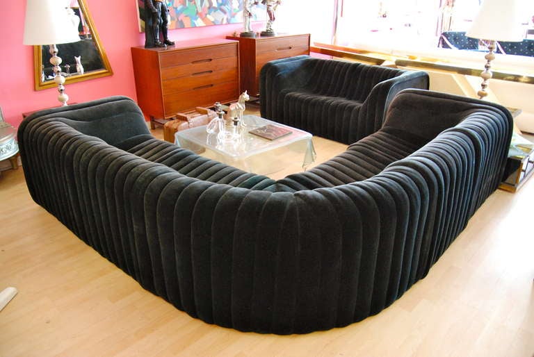 Superb Design!  Artima sectional sofa executed in black velvet. Great vertical channel design. Sofa comes complete with a two piece modular love seat measuring 67