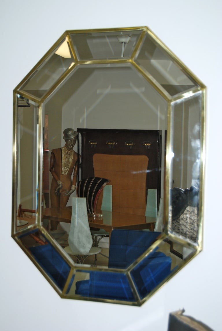 Elegant brass framed mirror by La Barge. Each piece of mirror has been individually beveled . Nice warm patina to brass frame. Mirror measures 43