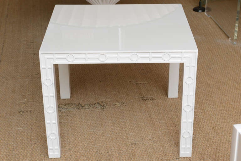 These vintage white lacquered over wood side or end tables have great top space. The wonderful graphic design on the apron and all the legs make for a sculptural look. They are simple and stunning, graphic and sculptural! They could also be used as