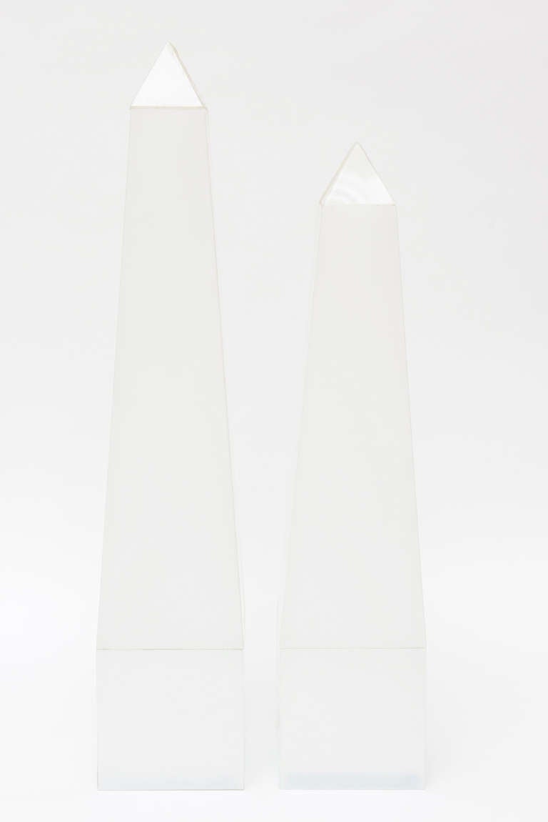 These opaque white pair of vintage Lucite obelisks have glass bottoms. They are wonderful! Two different sizes, sold as a pair.
The smaller size is 18.5