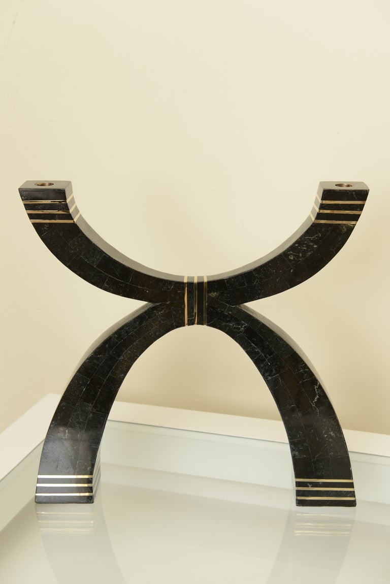 This amazing and monumental black stone and branded stepped brass candlebra or large candlestick has great presence. Great shape and form.
It has two arch forms. it was designed by Marcius for Casa Bique.
It is in the understanding that only 30 of