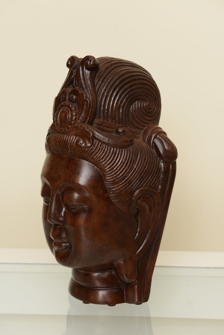 This vintage and early Kwan Yin Buddha head is heavy resin and looks like bakelite. It has the original period label on it from the late 1920s or early 1930s.
