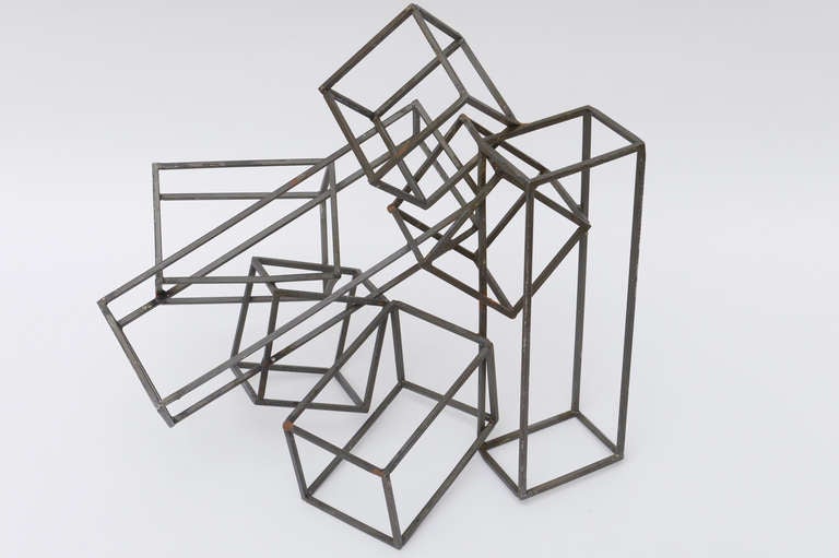 from every angle this interesting cube sculpture changes...
it is very Sol Le Witt
Steel