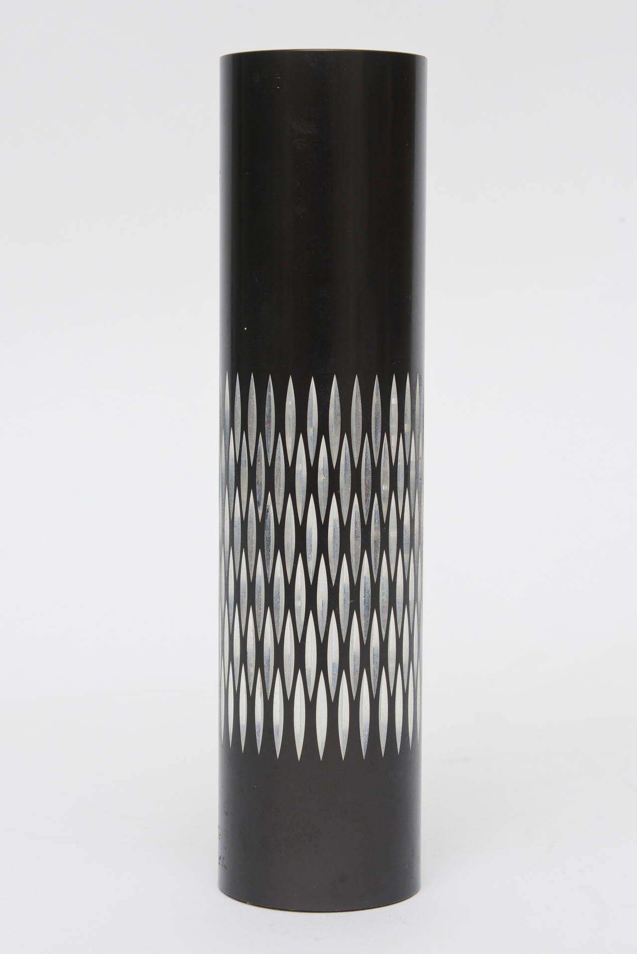 This wonderful English vintage graphic cylinder and or vase period black metal vase with textured diamond patterned indented silver is unusual. It could be used for makeup brushes, a desk accessory, a small cylinder vase or a chic pencil and pen